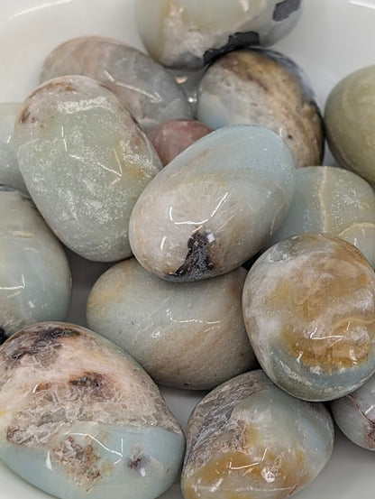 Close-up of Blue Sky Opal stones highlighting polish, banding, and natural matrix