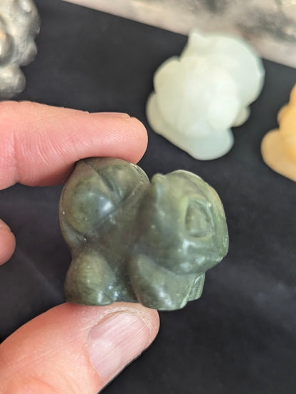 Side profile view of a Green Jasper Bulbasaur showing the carved bulb detail.
