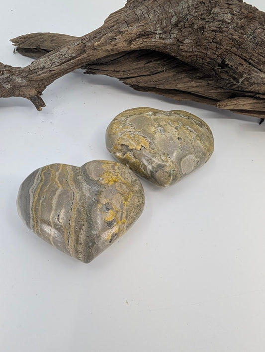 Pair of Bumblebee Jasper hearts showing yellow and grey volcanic banding