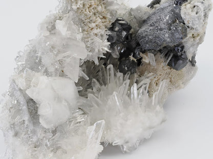 Mid-range angled shot highlighting the contrast between the dark pyrite and clear quartz.