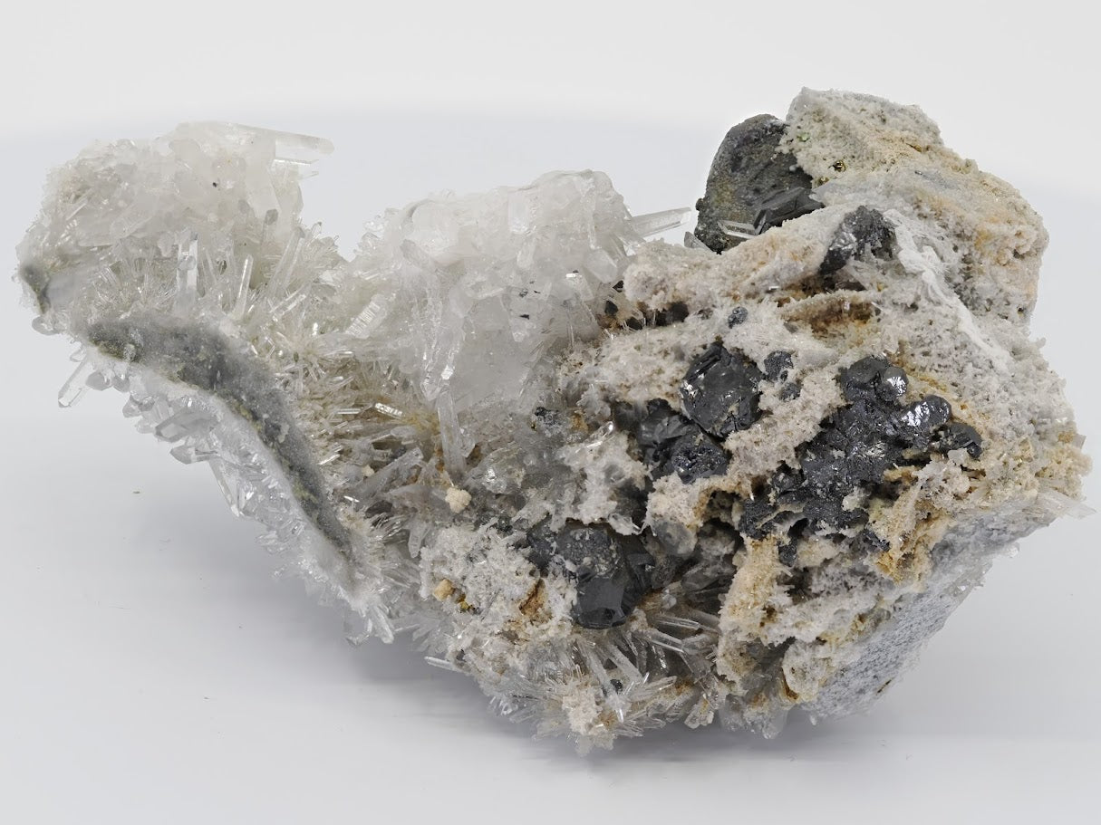 Detailed rear angle view of the Burmese mineral specimen showing the quartz structure behind the main pyrite formation.