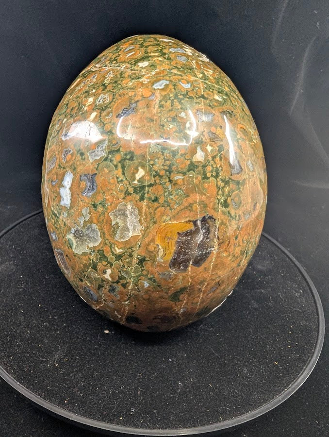 Right side profile highlighting concentric “eye” patterns and high polish