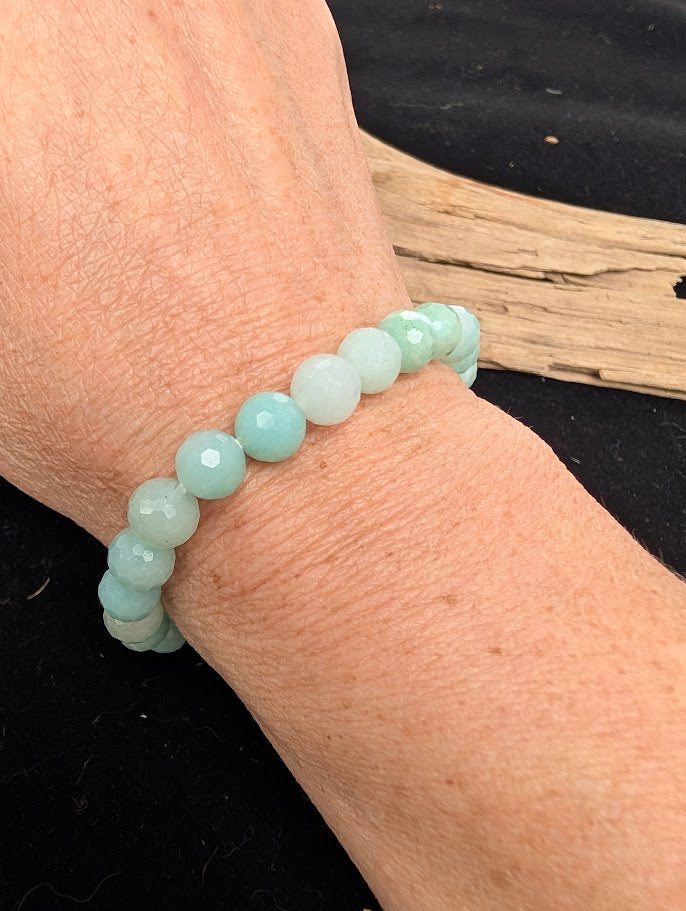 8mm faceted HQ Caribbean Calcite beaded stretch bracelet worn on a wrist for size scale.