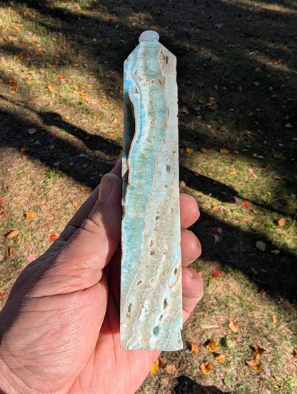 Caribbean Calcite Tower #2 angled view – polished aqua-blue calcite with beige aragonite inclusions