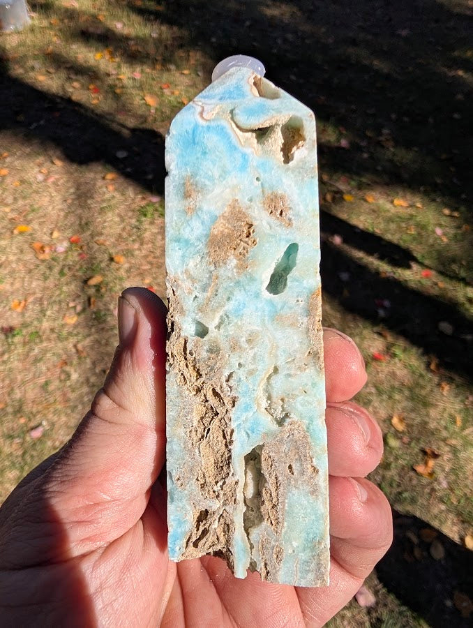 Caribbean Calcite Tower #3 angled view — strong banding and open cavities, slim profile