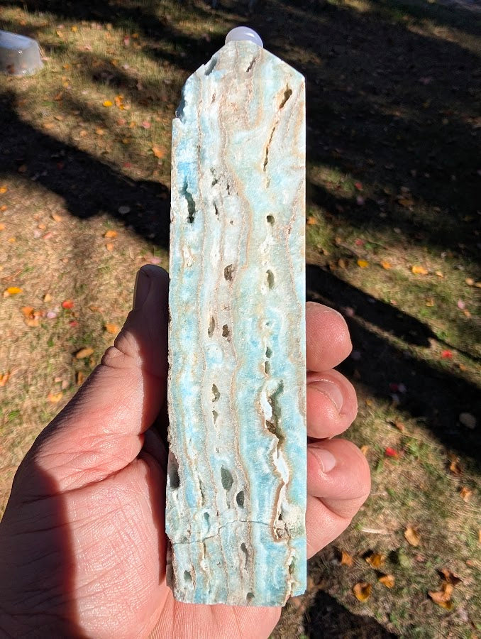 Caribbean Calcite Tower #4 side profile — elongated banding and natural cavities