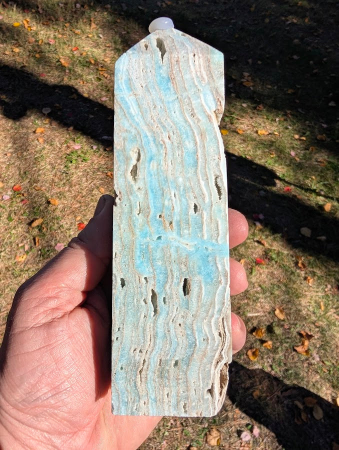 Caribbean Calcite Tower #5 side profile — tall banded calcite–aragonite layers with cavities