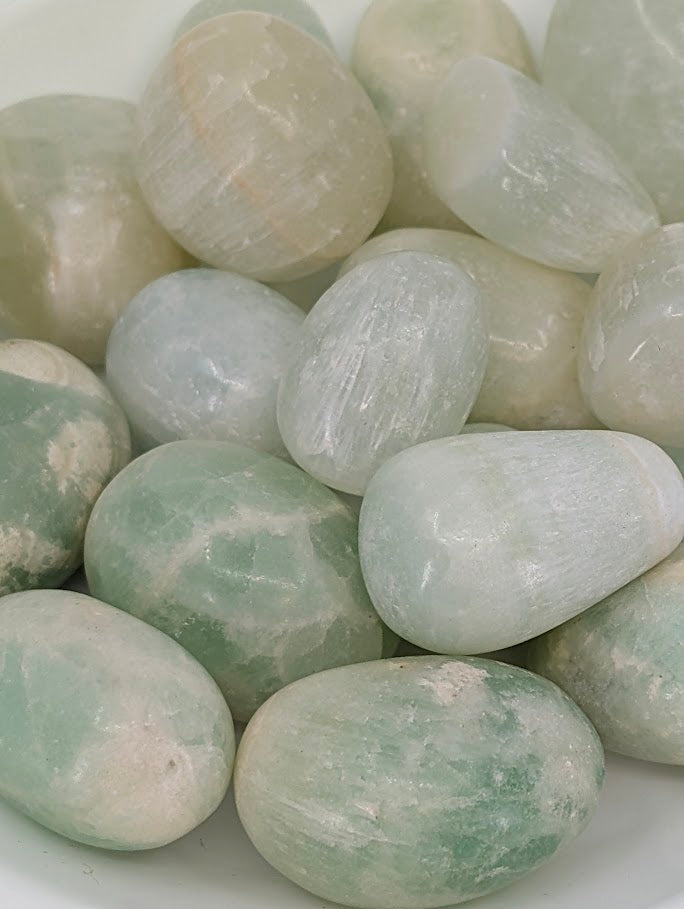 Close-up of Caribbean Calcite showing aqua and beige banding