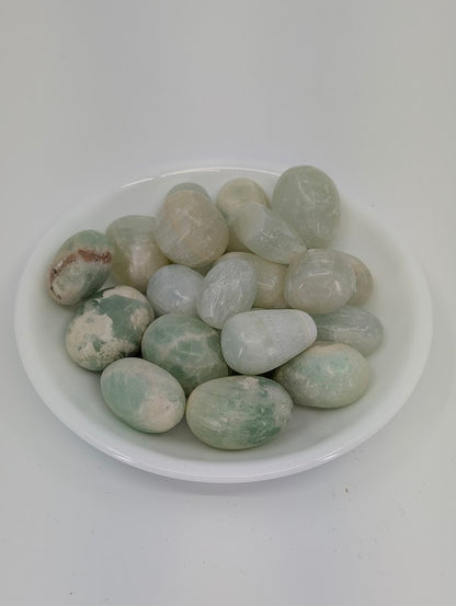 Caribbean Calcite tumbled stones A grade in bowl