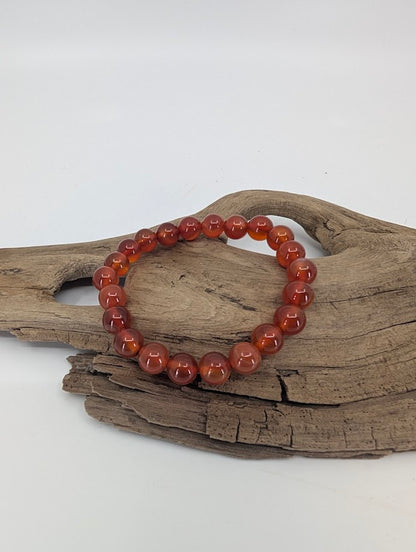 AAA Carnelian bracelet with translucent fiery orange chalcedony beads, 8mm polished round stones