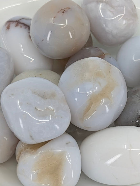 Close-up of Chalcedony tumbled stones showing soft grey-white tones