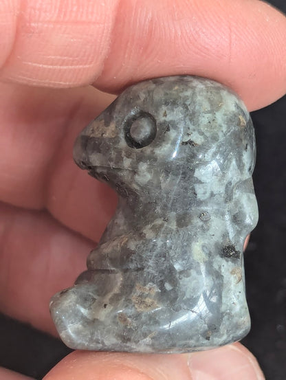 Macro profile shot showing the crystalline structure of a Labradorite Charmander totem.