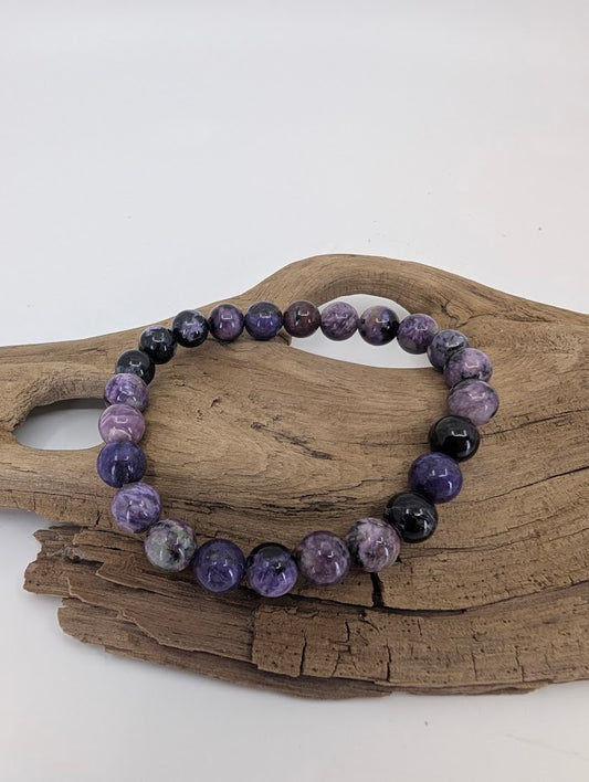 Charoite bracelet 8mm with natural violet swirls and black inclusions