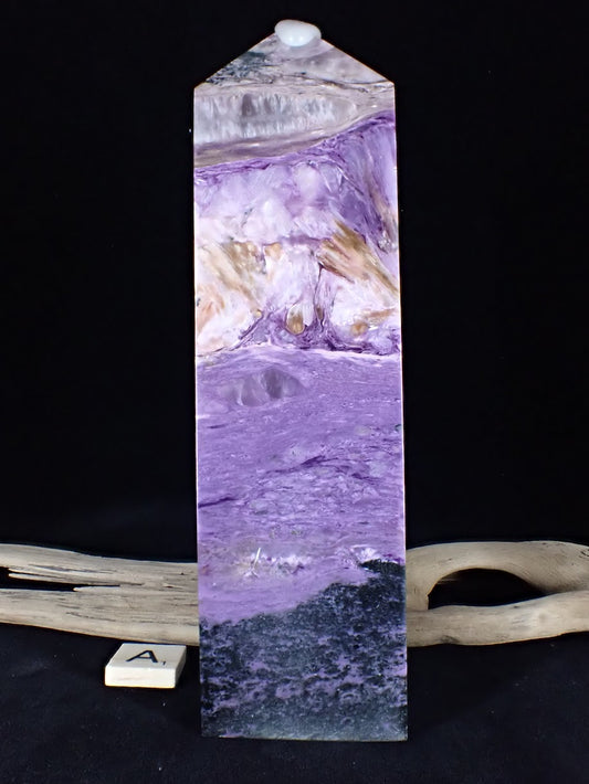 Front view of Charoite Tower A showing a black Aegirine base, purple center, and white cap.