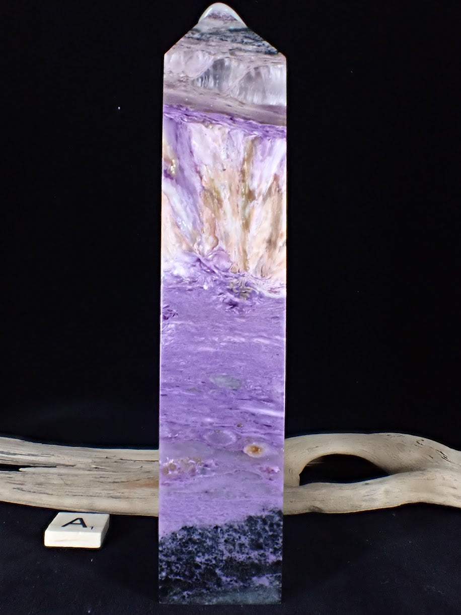 Angled view of Charoite Tower A highlighting the transition from black matrix to purple swirls.