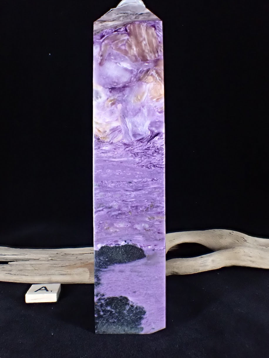 Side profile of Charoite Tower A displaying golden Tinaksite blades mixing with violet.