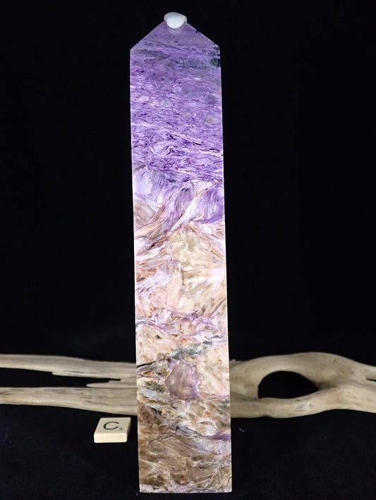 Front view of the massive Charoite Tower C, displaying a 'desert landscape' of beige matrix and purple peaks