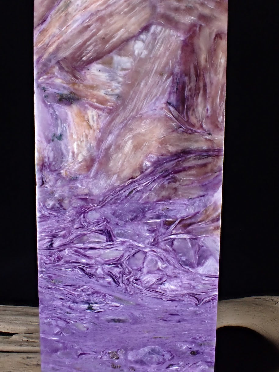 Macro close-up of the tight, silky purple Charoite fibers on the premium Tower D