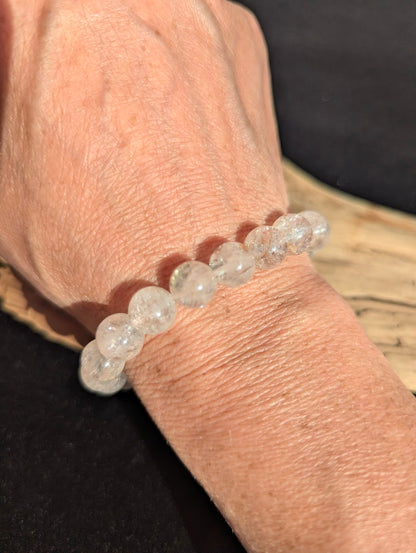 10mm AAA Grade Brazilian Cherry Blossom Garden Quartz beaded stretch bracelet worn on a wrist for scale demonstration.