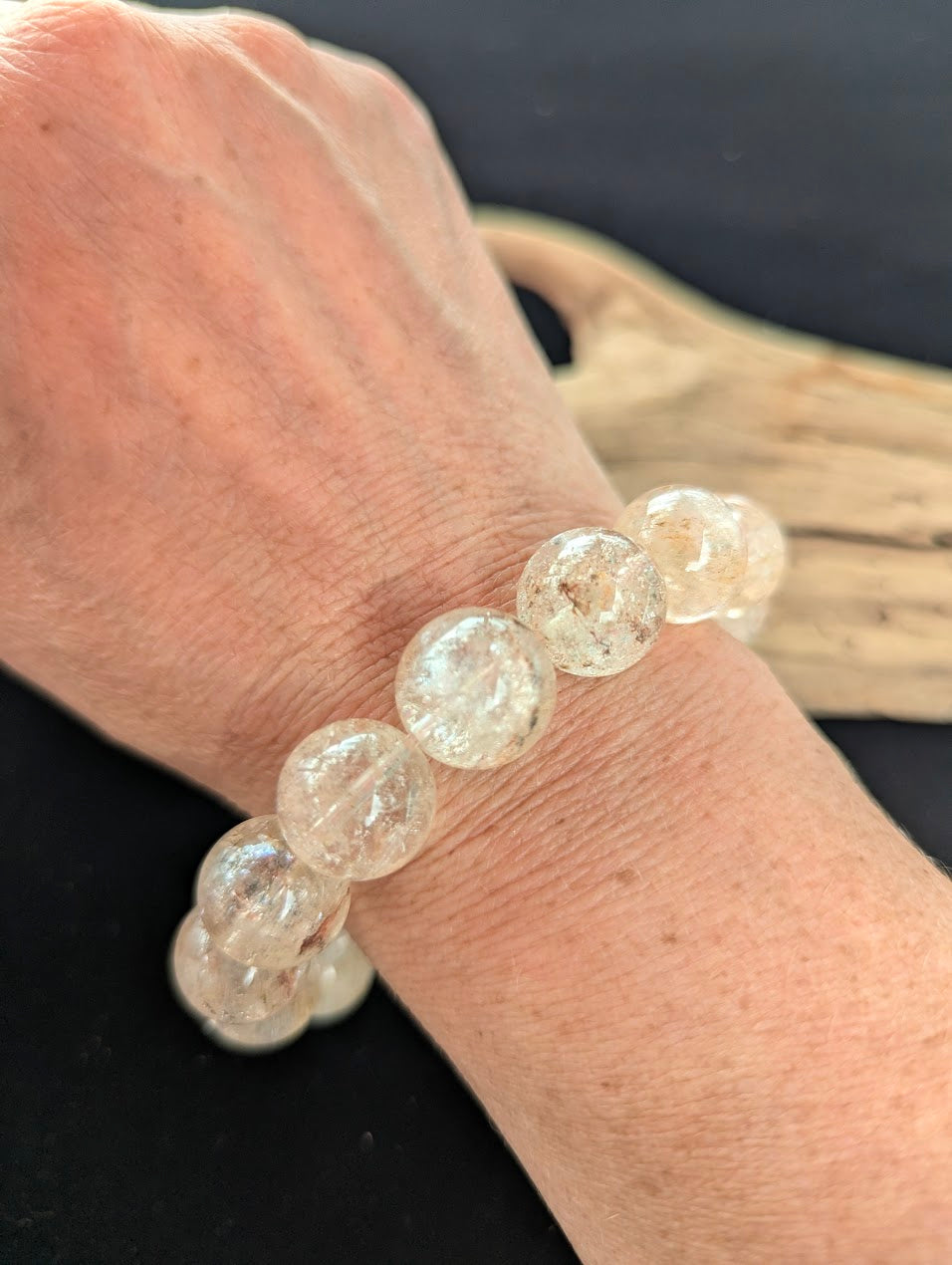 15mm AAA Grade Brazilian Cherry Blossom Garden Quartz beaded stretch bracelet worn on a wrist for scale demonstration.
