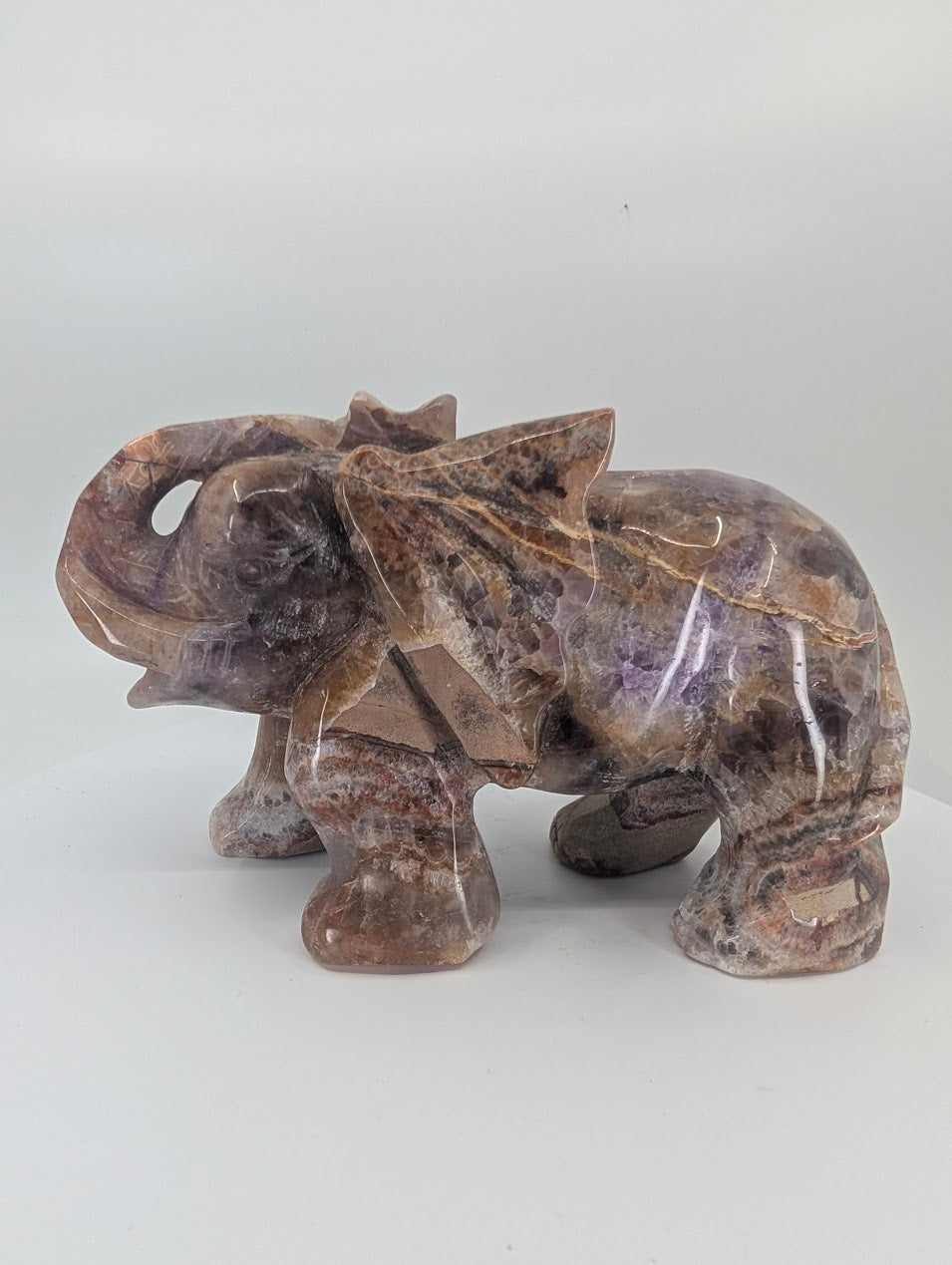 Chevron Amethyst elephant carving, left side angle