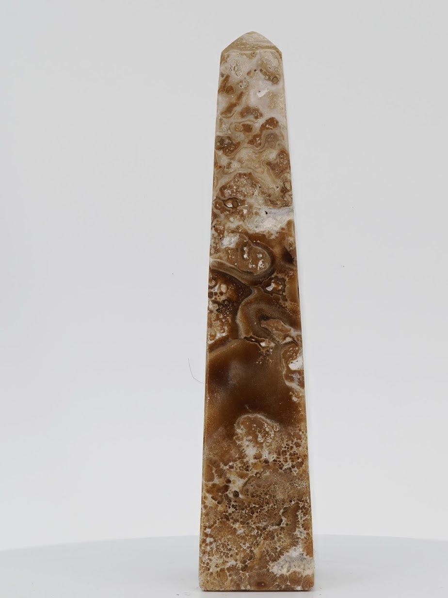 Exact-piece Chocolate Banded Onyx obelisk from Pakistan showcasing high-contrast mahogany and ivory horizontal layering.