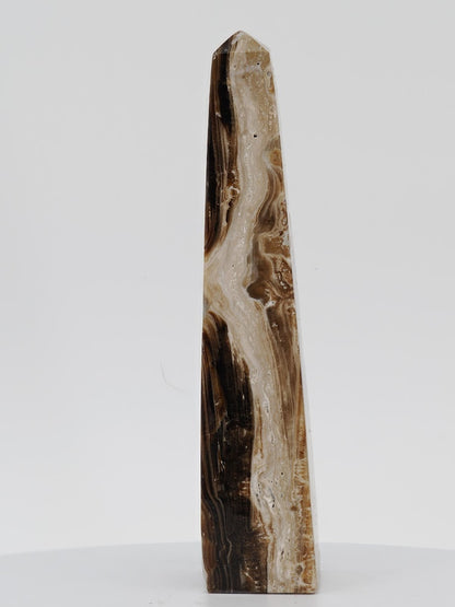 The base and structural profile of a 5-inch polished Chocolate Banded Onyx tower from the Balochistan region.