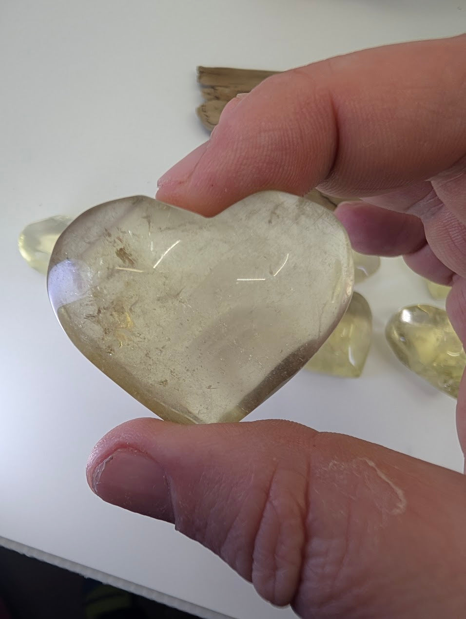 Natural Citrine Heart from DR Congo, 55g. Polished honey-gold quartz with internal veils and phantoms.