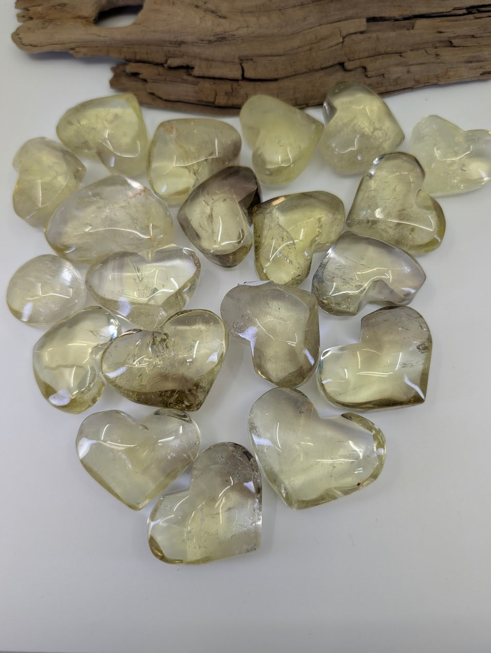 Multiple Natural 35g Citrine Hearts from the DRC, illustrating the variation in natural golden and smoky tones.