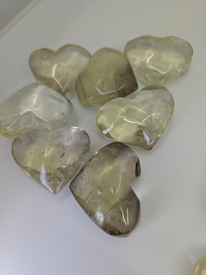 Multiple Natural 55g Citrine Hearts from the DRC, illustrating the variation in natural golden and smoky tones.