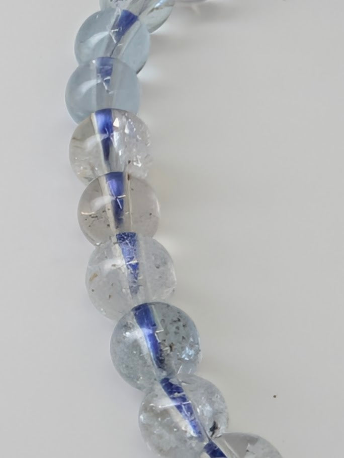 Detailed view of aquamarine bead structure and inclusions