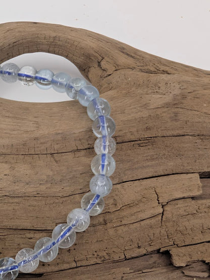 Close-up of clear aquamarine beads showing natural clarity