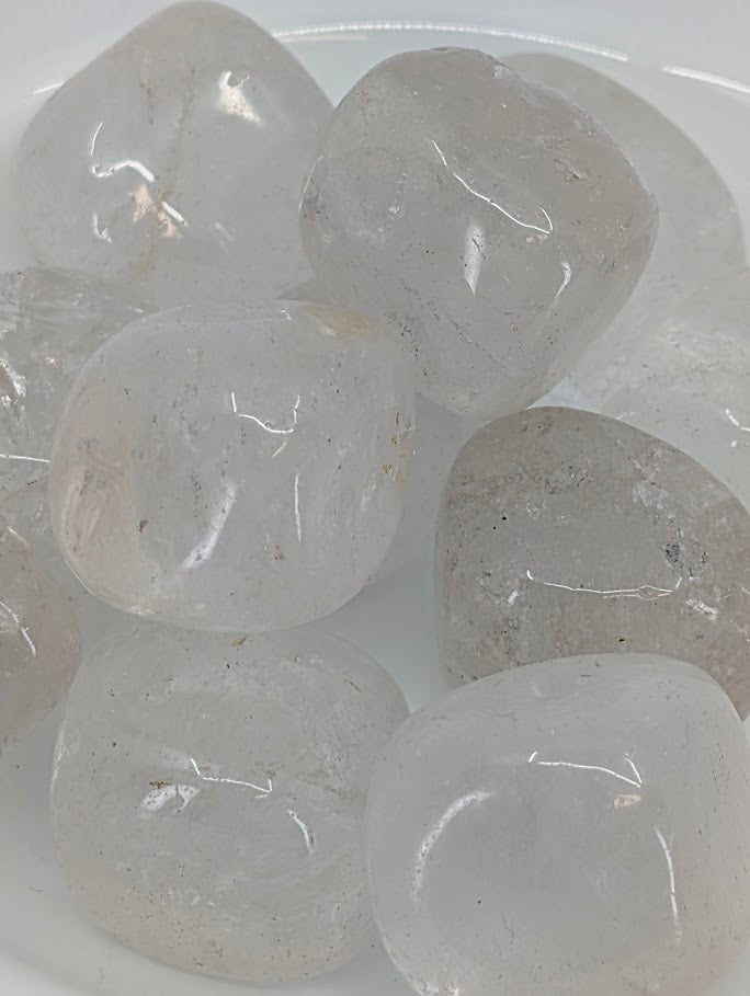 Close-up of Clear Quartz tumbled stones showing internal inclusions