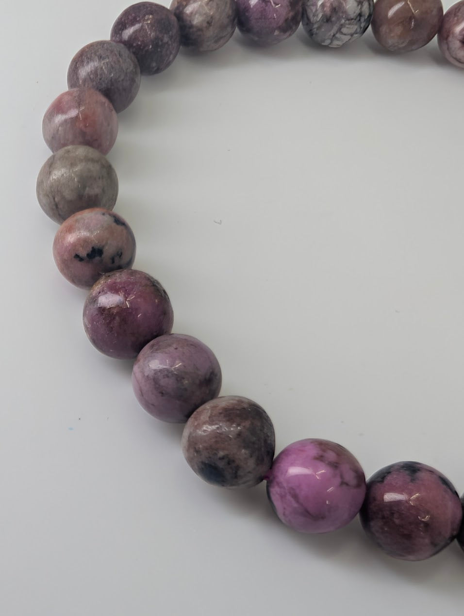Detail of natural pink and lilac mottled Cobaltoan Calcite beads