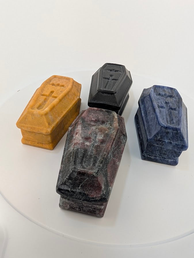 Top view of four crystal coffin carvings