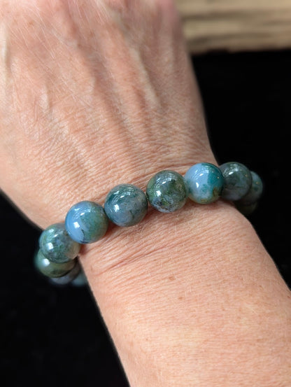 Bold 13mm Dark Moss Agate gemstone bracelet styled on a wrist for a prominent, grounding look.
