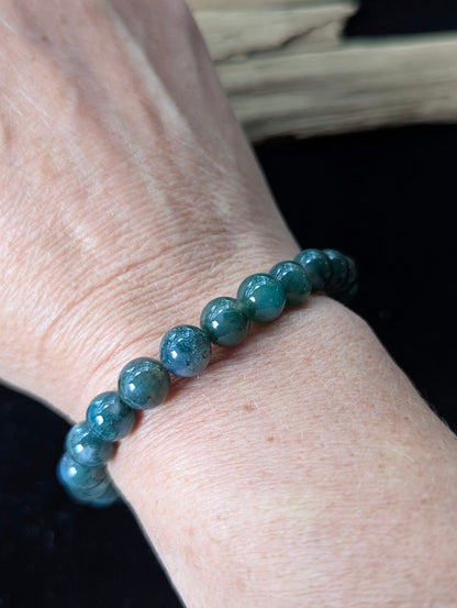 9mm Dark Moss Agate beaded bracelet styled on a wrist, showing comfortable fit and rich forest-green tones.