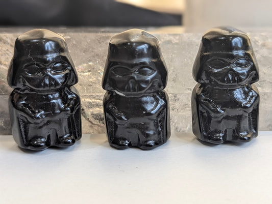 A group of three hand-carved Black Obsidian Darth Vader tiny totems.