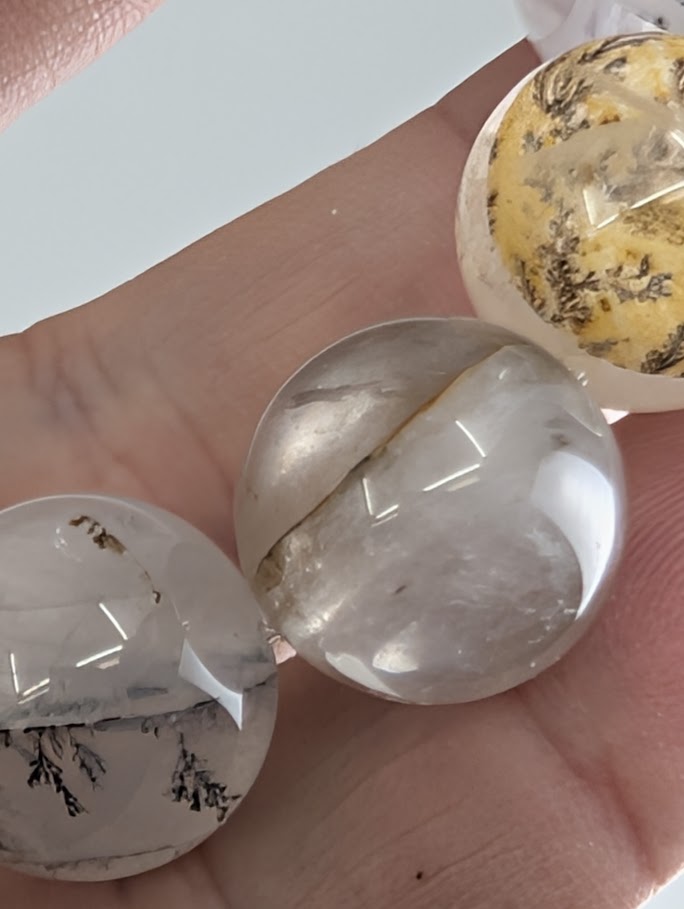 16mm dendritic quartz bracelet showing natural manganese oxide inclusions and clear quartz beads.