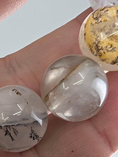 16mm dendritic quartz bracelet showing natural manganese oxide inclusions and clear quartz beads.