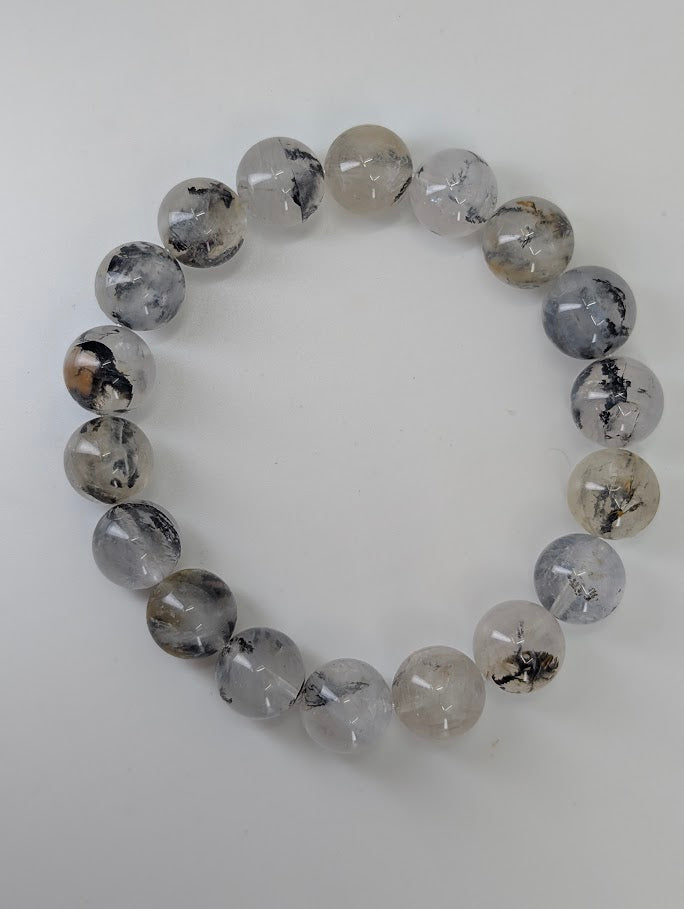 8mm dendritic quartz bracelet photographed from top view showing full bead patterning.