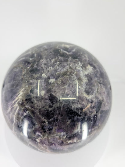 Dream Amethyst sphere showing deep purple tones and smooth mirror polish