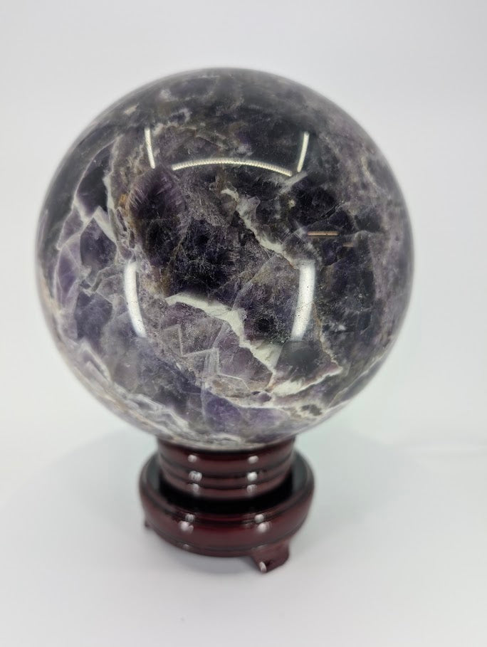Detail image of Dream Amethyst sphere displaying intricate quartz structure