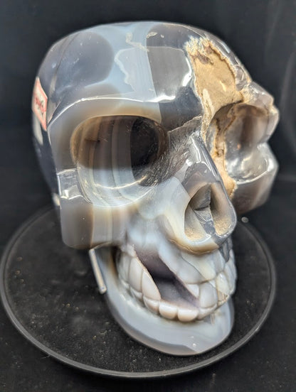Three-quarter right view highlighting polished agate and druzy pocket