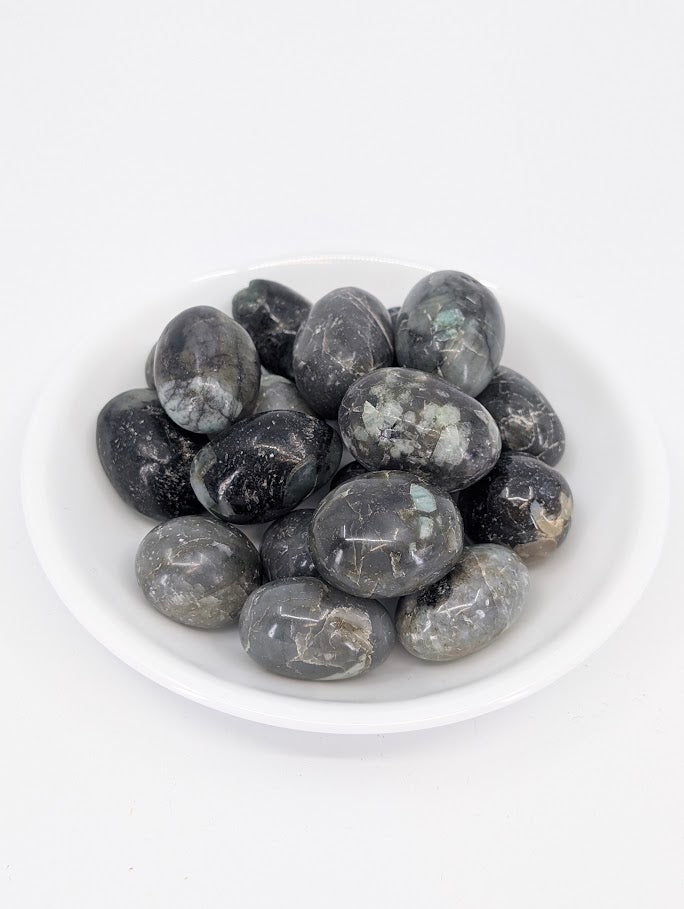 Emerald tumbled stones A grade in bowl