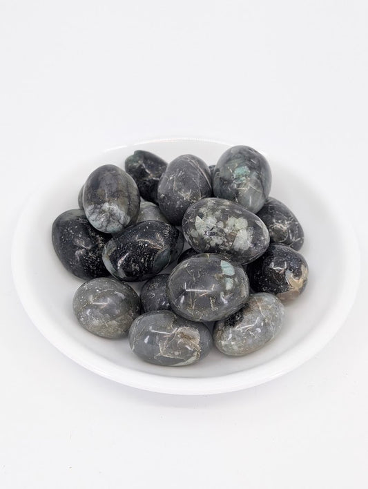 Emerald tumbled stones A grade in bowl