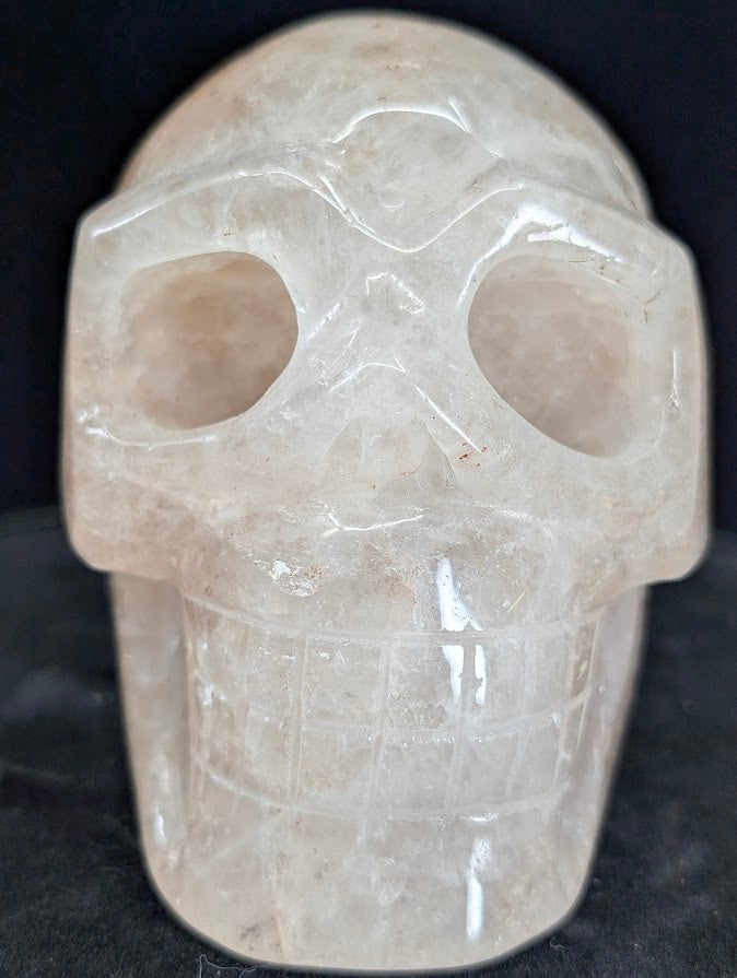 Fire Quartz (Hematoid Quartz) skull, front view showing translucent body and hematite veils