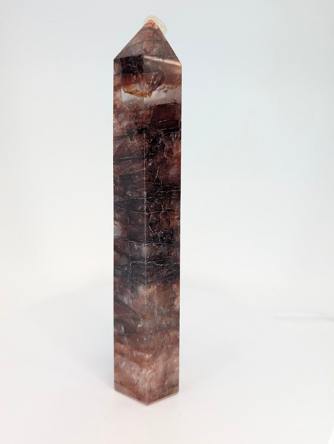 Hematoid Quartz tower showing layered hematite bands