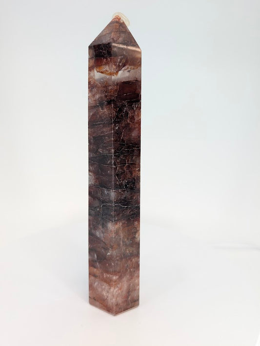 Hematoid Quartz tower showing layered hematite bands