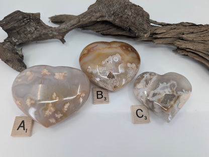 Group of three Flower Agate hearts labeled A, B, and C showing blossom patterns.